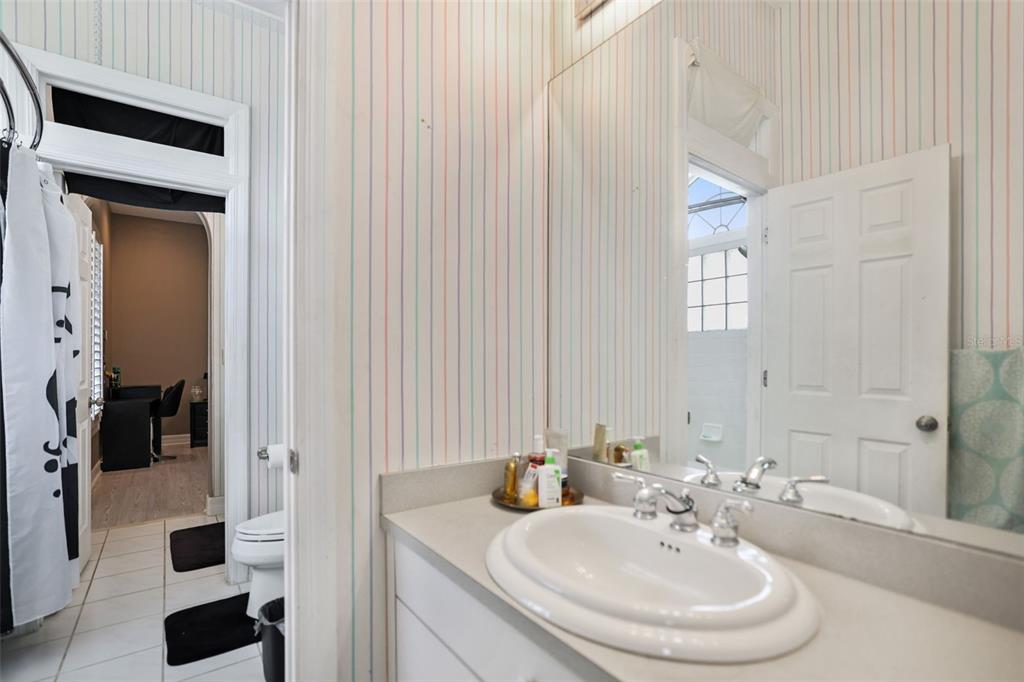 14423 Kandi Court Largo, FL 33774 - Photo 44 of 75 a bathroom with a sink and a mirror