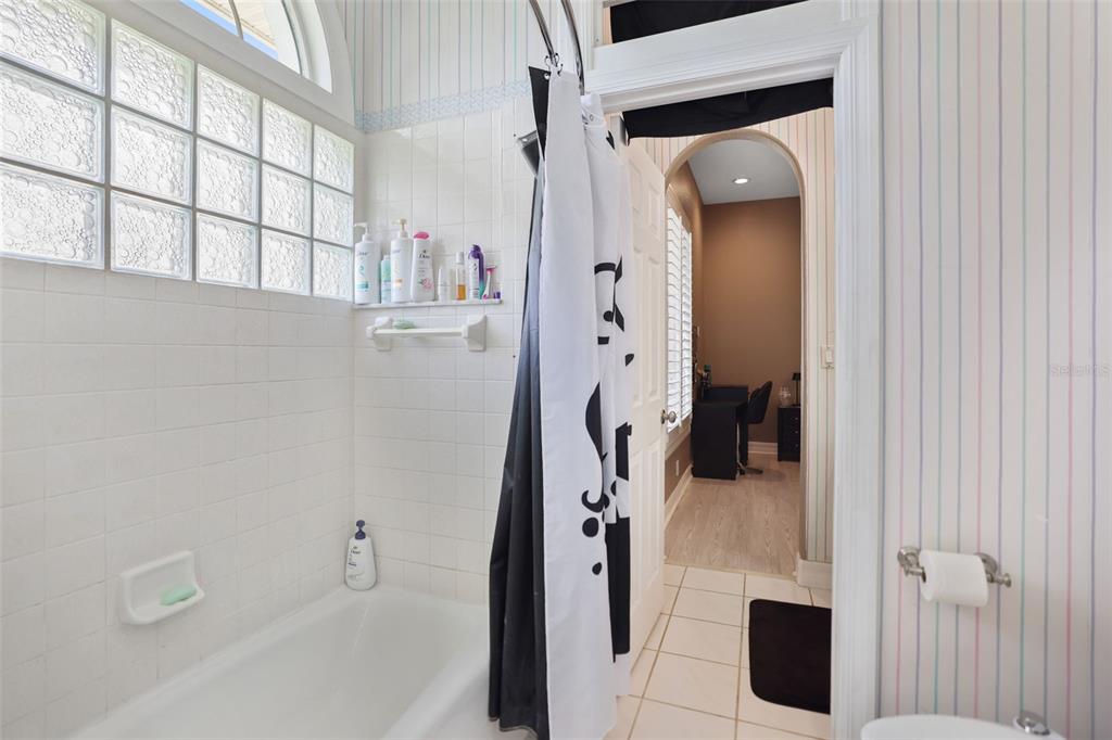 14423 Kandi Court Largo, FL 33774 - Photo 45 of 75 a bathroom with a tub and shower
