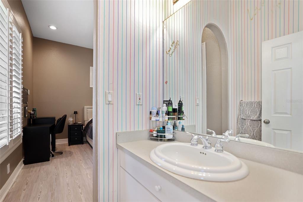14423 Kandi Court Largo, FL 33774 - Photo 47 of 75 a bathroom with a sink and a mirror