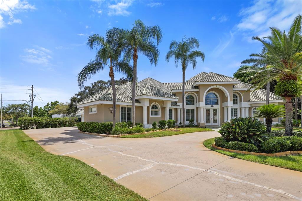 14423 Kandi Court Largo, FL 33774 - Photo 63 of 75 a front view of a house with a garden