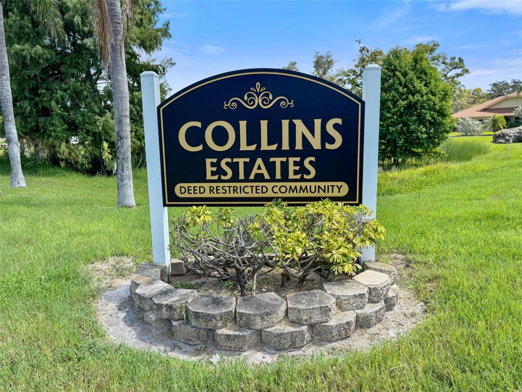 14423 Kandi Court Largo, FL 33774 - Photo 75 of 75 a sign broad in front of the red brick house