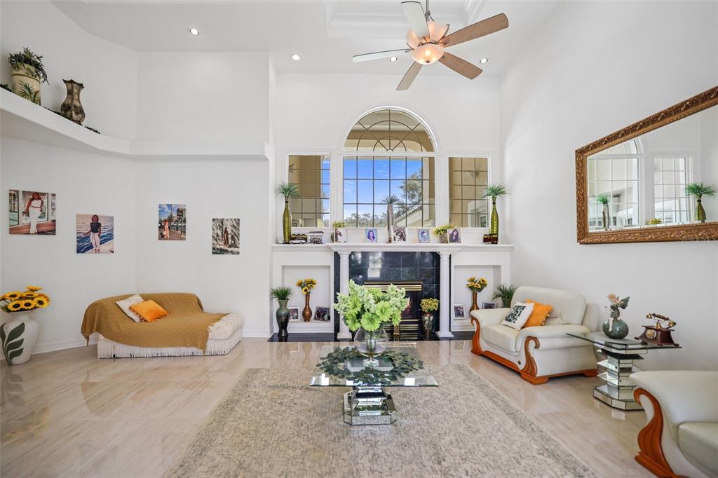 14423 Kandi Court Largo, FL 33774 - Photo 8 of 75 a living room with furniture a chandelier and a rug