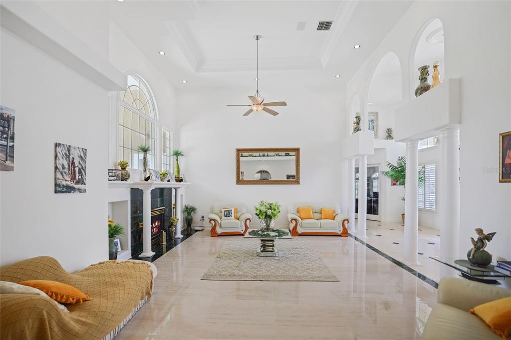 14423 Kandi Court Largo, FL 33774 - Photo 9 of 75 a bedroom with furniture and a chandelier