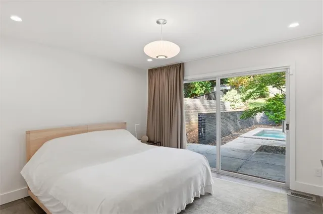 a bedroom with a bed and cabinets