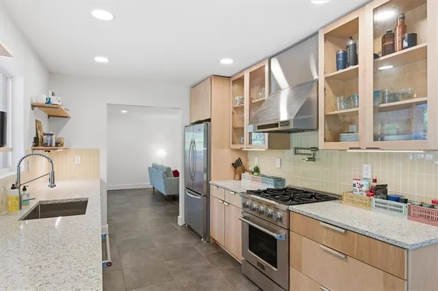 a kitchen with a sink and a window