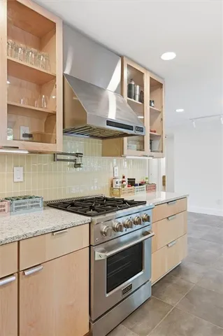 a kitchen that has a sink and a stove