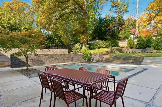 a view of swimming pool with a yard