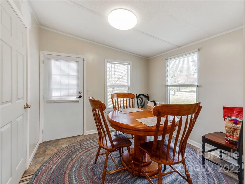 3402 Griffith Road Monroe, NC 28112 - Photo 11 of 28 a view of a dining room with furniture and window