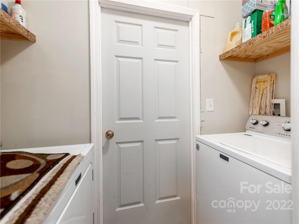 3402 Griffith Road Monroe, NC 28112 - Photo 16 of 28 a bathroom with a sink and a mirror