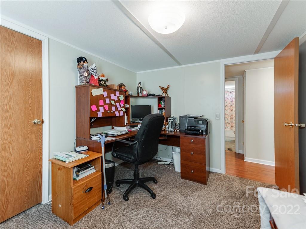 3402 Griffith Road Monroe, NC 28112 - Photo 20 of 28 a view of a workspace with furniture and a livingroom
