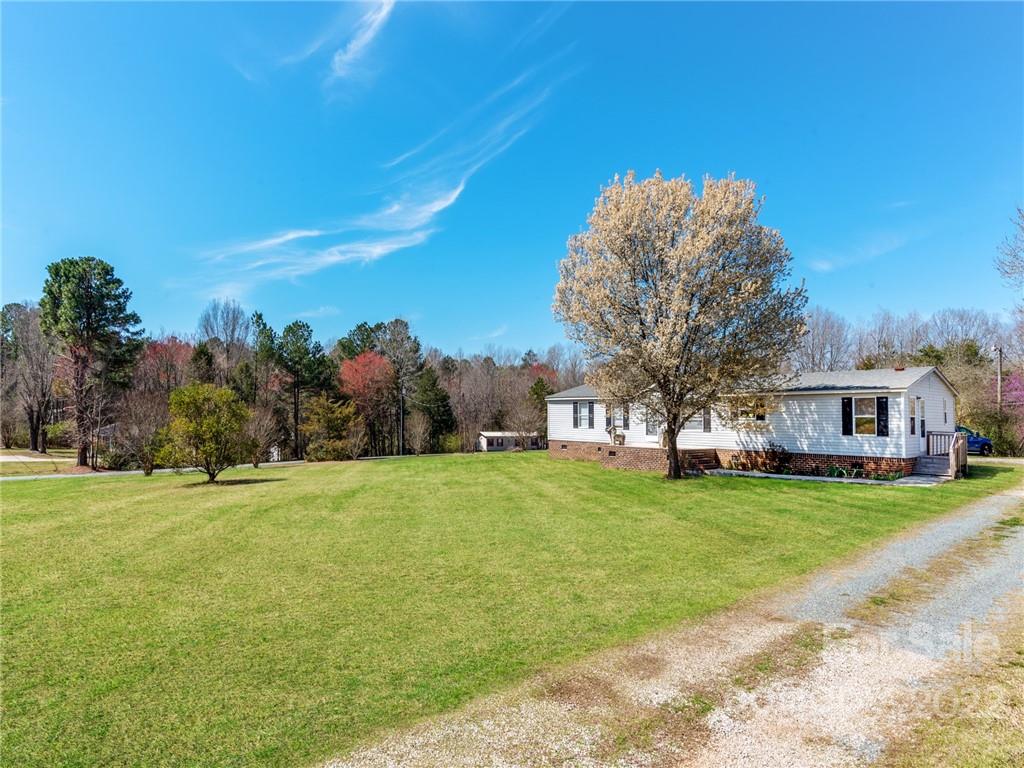 3402 Griffith Road Monroe, NC 28112 - Photo 2 of 28 a front view of a house with a yard and trees