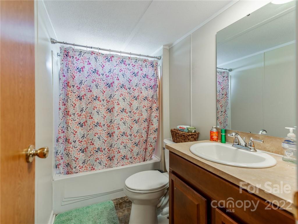 3402 Griffith Road Monroe, NC 28112 - Photo 23 of 28 a bathroom with a sink toilet and shower