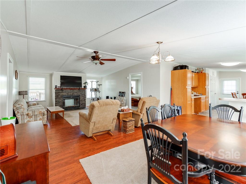 3402 Griffith Road Monroe, NC 28112 - Photo 4 of 28 a living room with furniture a fireplace and a flat screen tv