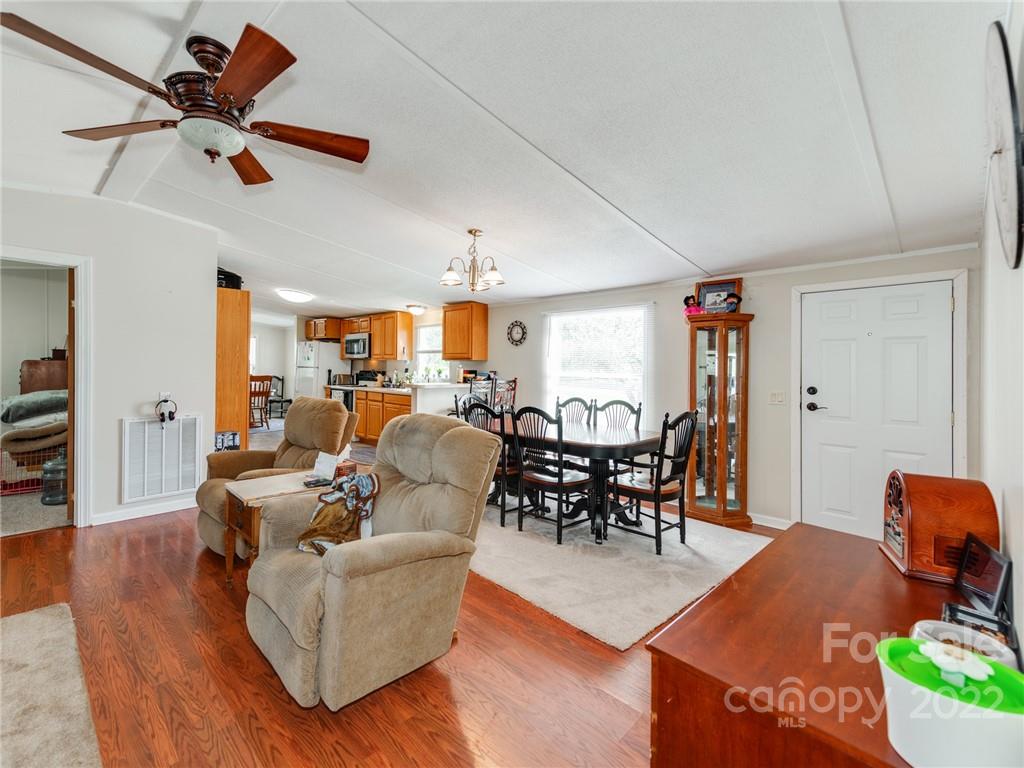 3402 Griffith Road Monroe, NC 28112 - Photo 5 of 28 a living room with furniture kitchen view and a wooden floor