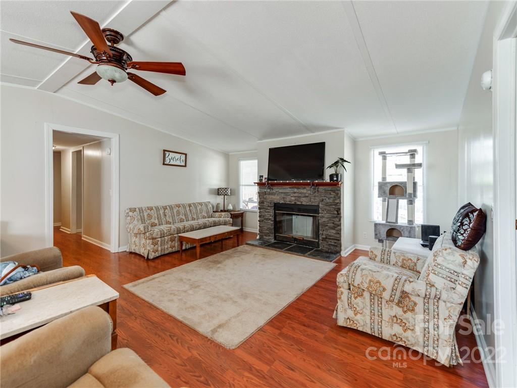 3402 Griffith Road Monroe, NC 28112 - Photo 6 of 28 a living room with furniture and a fireplace