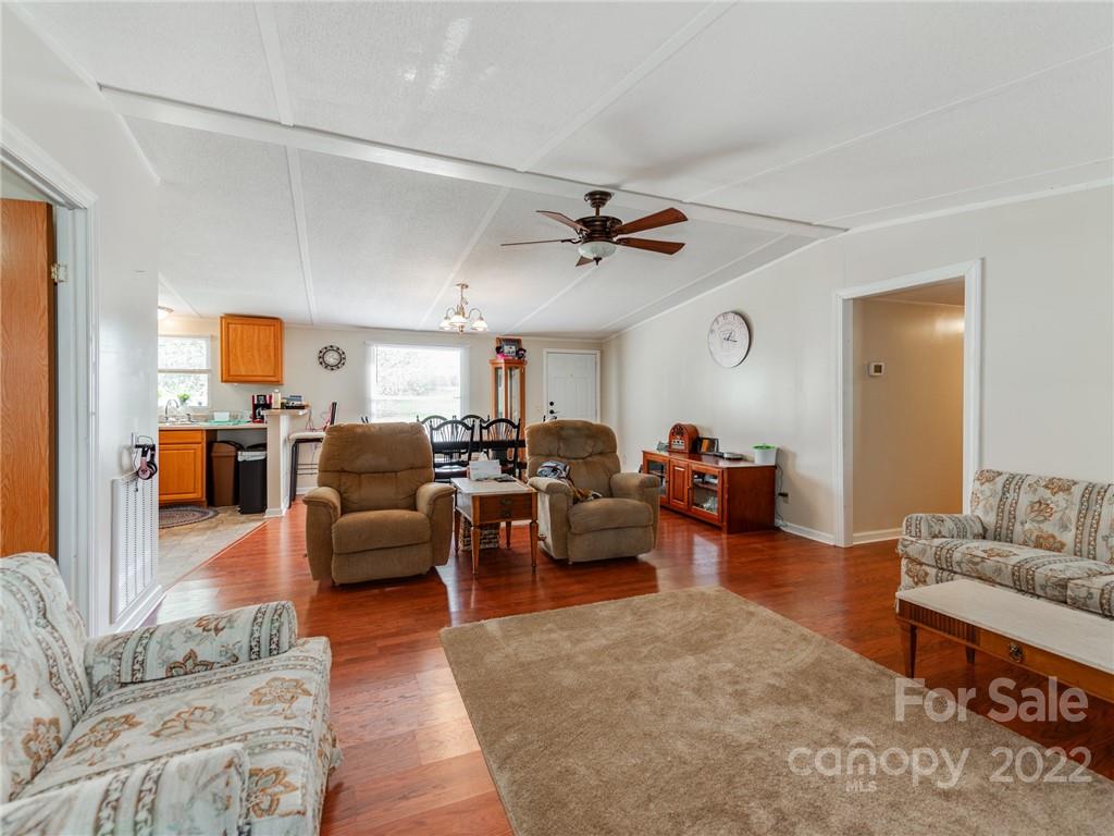 3402 Griffith Road Monroe, NC 28112 - Photo 7 of 28 a living room with furniture kitchen view and a wooden floor
