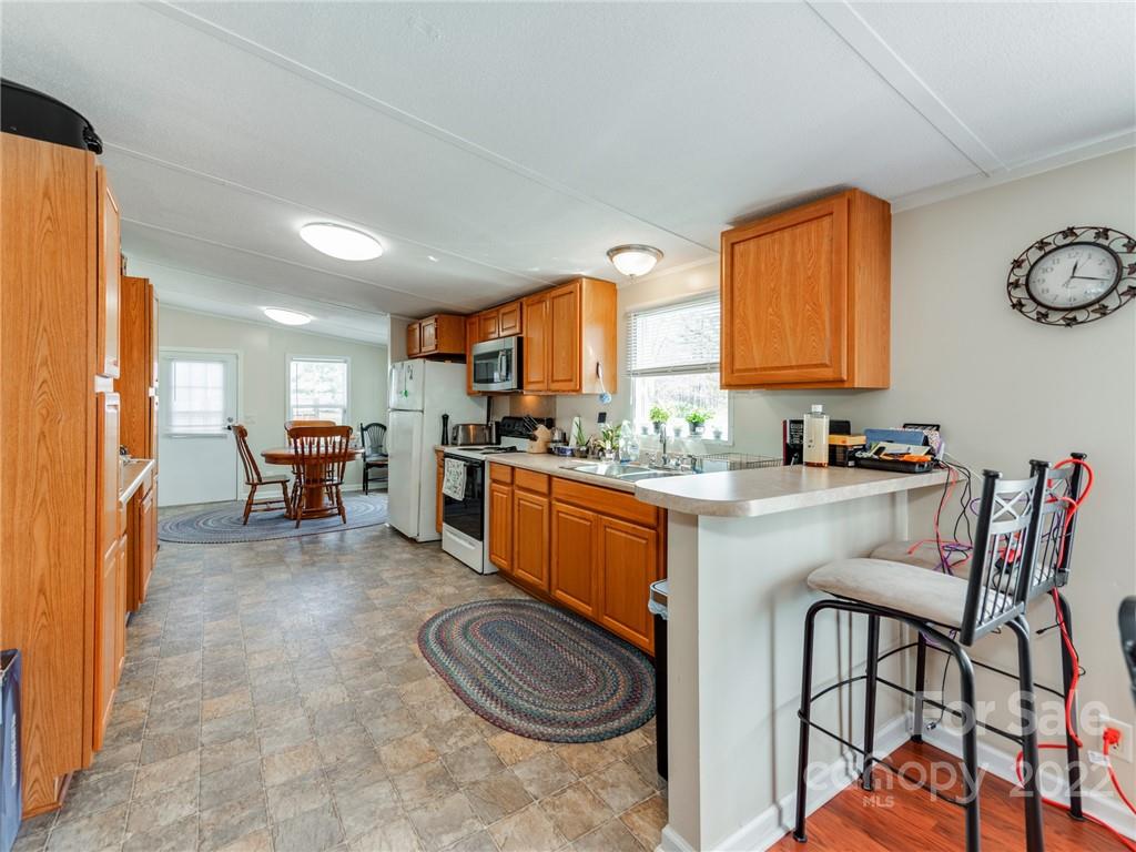 3402 Griffith Road Monroe, NC 28112 - Photo 8 of 28 a kitchen with a sink cabinets and window