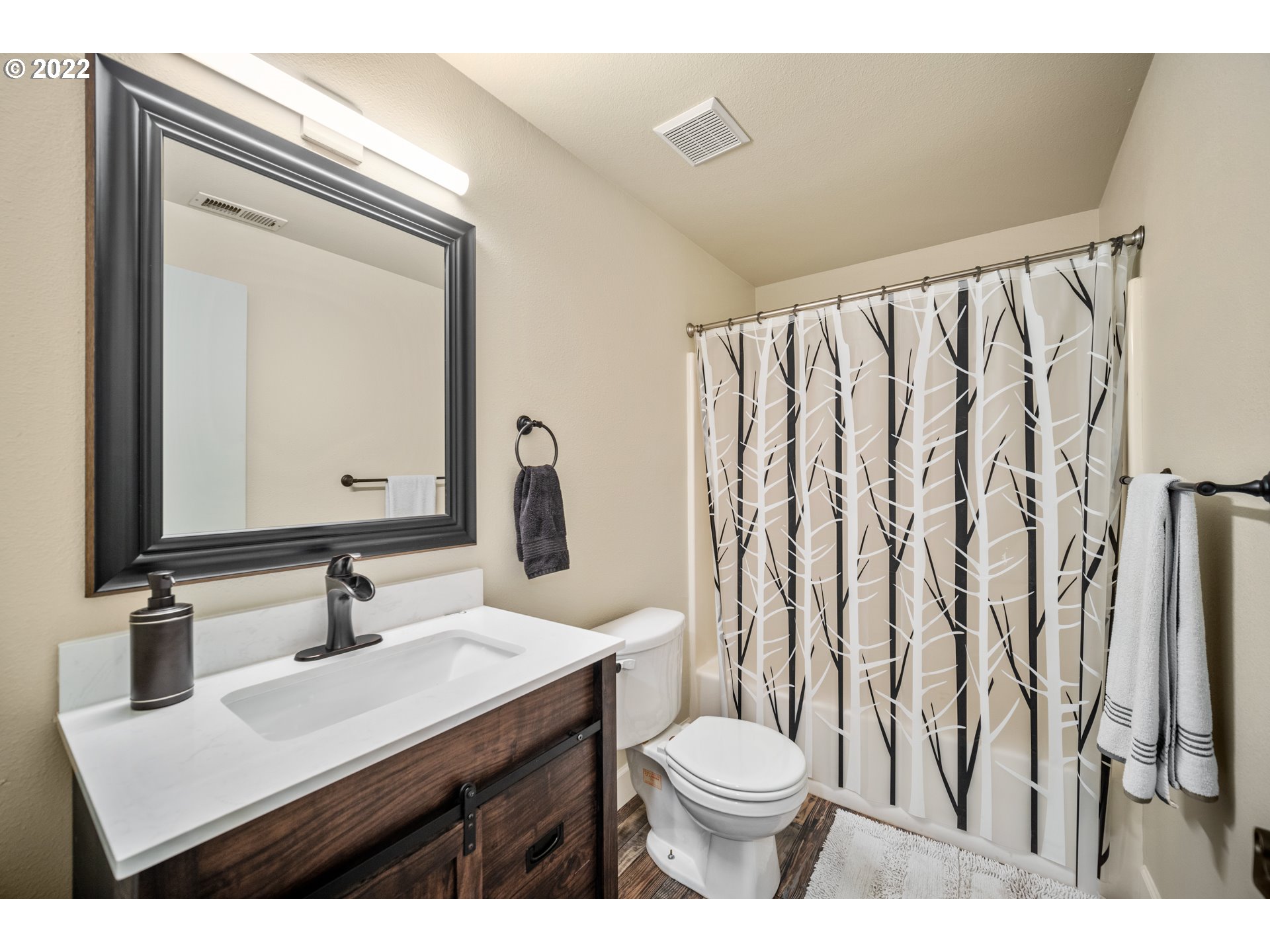 16207 Northeast Beebe Road Battle Ground, WA 98604 - Photo 16 of 32 a bathroom with a toilet a sink and a mirror