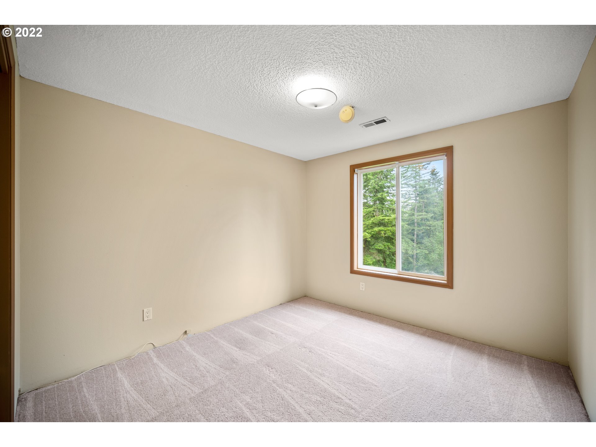 16207 Northeast Beebe Road Battle Ground, WA 98604 - Photo 20 of 32 a view of an empty room with a window