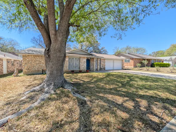 a house with trees in front of it