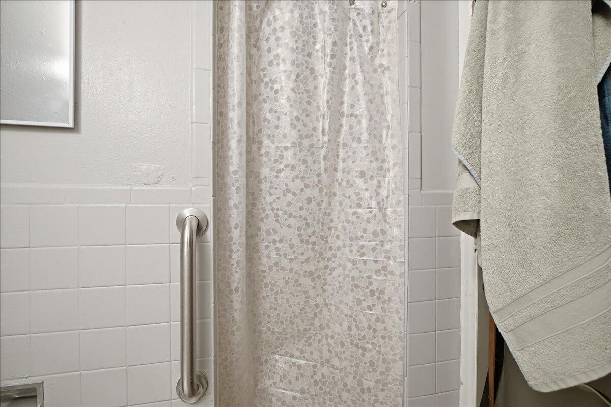 3816 44th Street Lubbock, TX 79413 - Photo 14 of 36 a bathroom with a shower