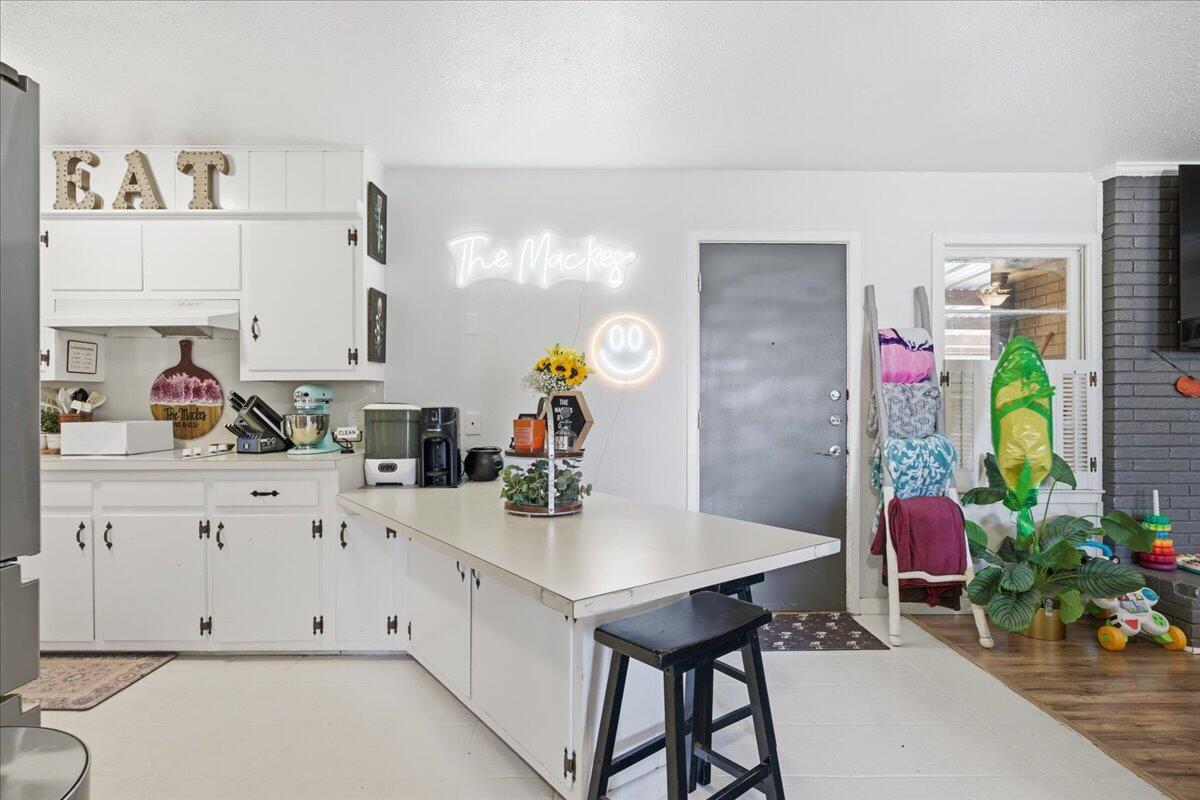3816 44th Street Lubbock, TX 79413 - Photo 8 of 36 a kitchen with stainless steel appliances cabinets and a potted plant