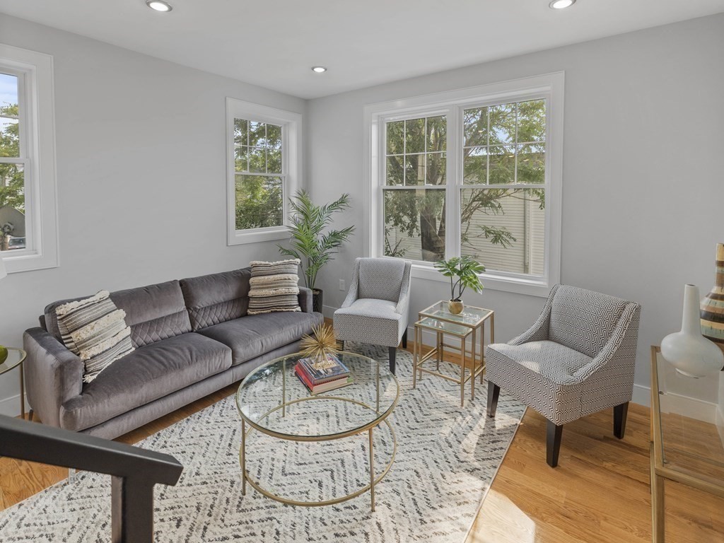 106-116 Main Street Everett, MA 02149 - Photo 11 of 24 a living room with furniture and a window