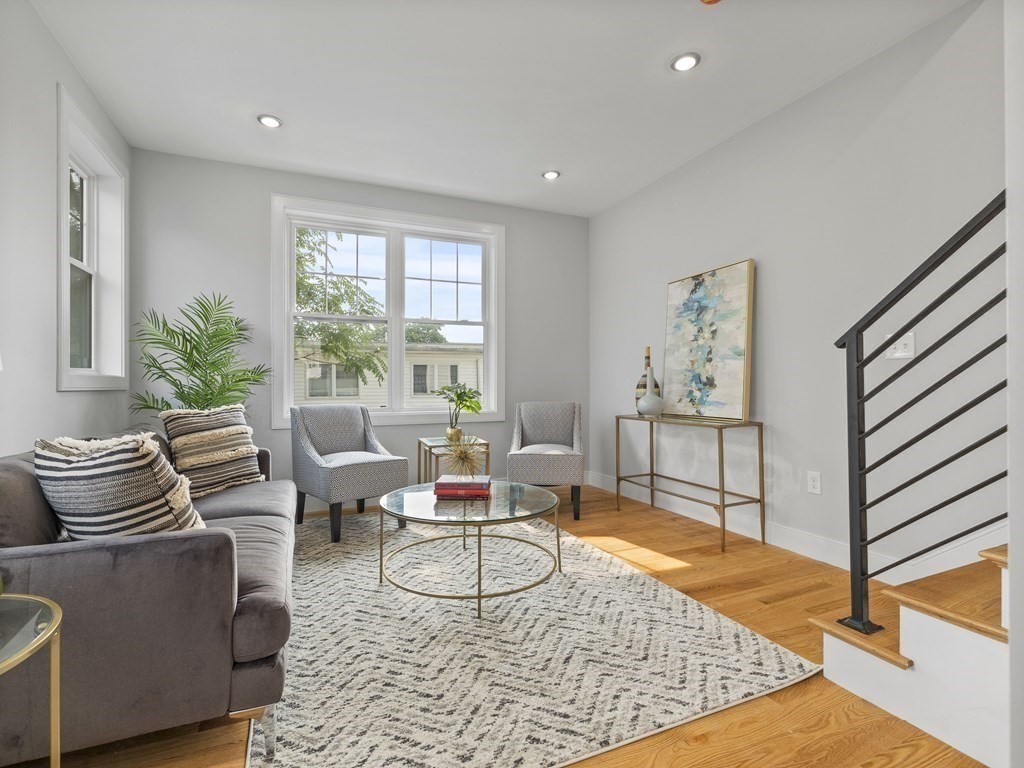 106-116 Main Street Everett, MA 02149 - Photo 13 of 24 a living room with furniture and a window