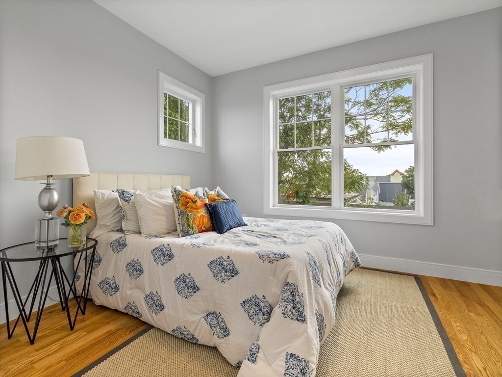 106-116 Main Street Everett, MA 02149 - Photo 15 of 24 a bedroom with a bed and a window
