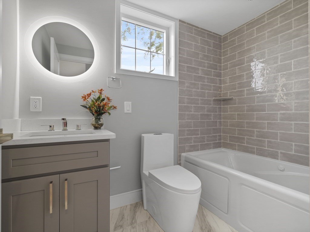 106-116 Main Street Everett, MA 02149 - Photo 16 of 24 a bathroom with a sink a toilet and a bathtub