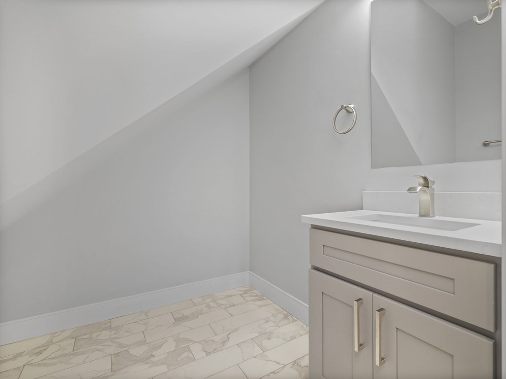 106-116 Main Street Everett, MA 02149 - Photo 10 of 24 a utility room with a sink and vanity