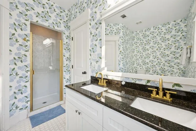 a bathroom with a sink and a mirror