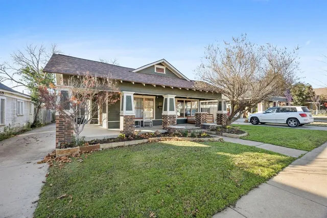 a front view of a house with swimming pool having outdoor seating
