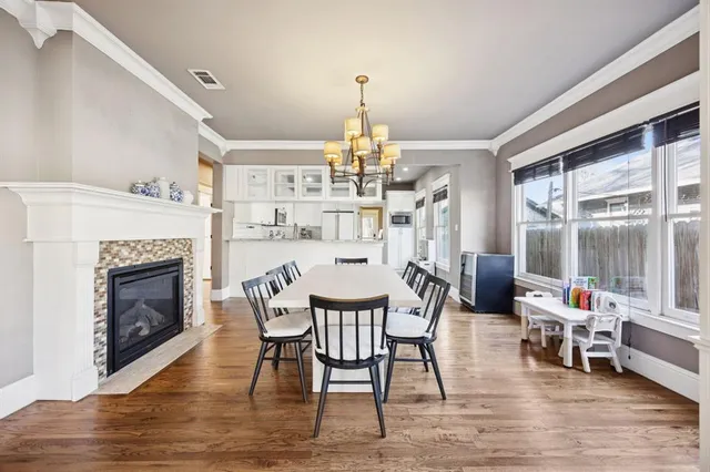 a view of a livingroom with furniture window and wooden floor