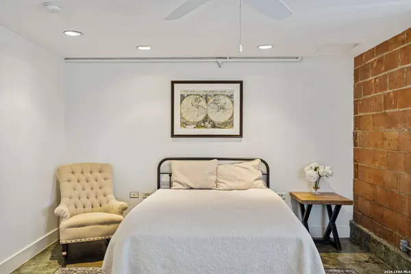a bedroom with a bed and a table