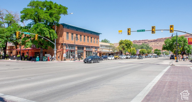 2331 Mesa Road, Unit E3 Moab, UT 84532 - Photo 59 of 71 View of asphalt street featuring traffic lights, sidewalks, street lights, and curbs