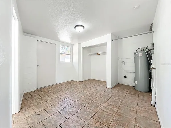 a bedroom with furniture and a chandelier