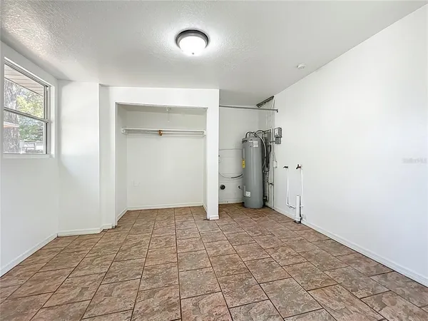 a view of a kitchen cabinets a sink and a dishwasher in a room