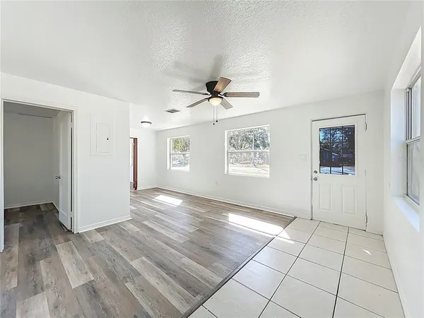 a kitchen with granite countertop cabinets and window