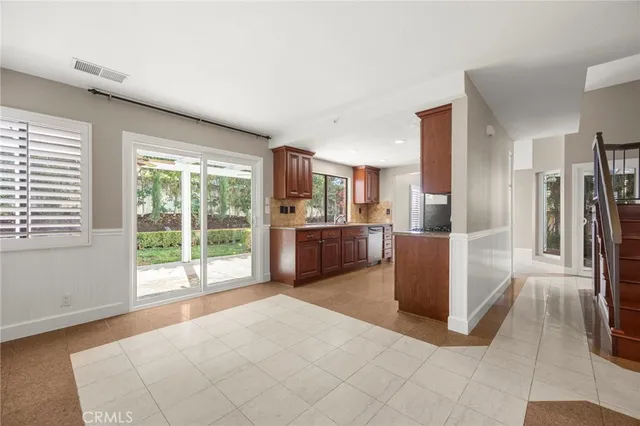 a room with a large bed and a large window