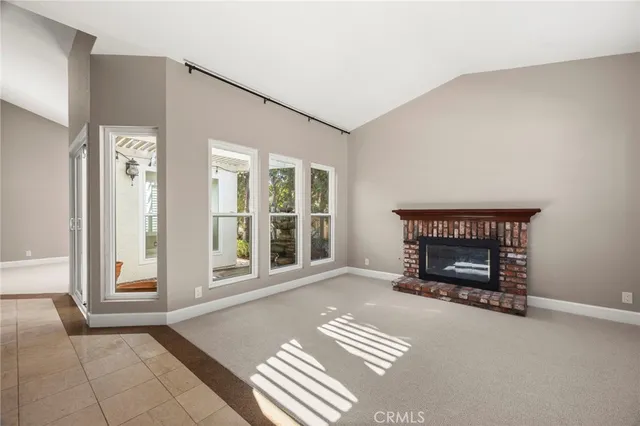 a view of an empty room with a fireplace