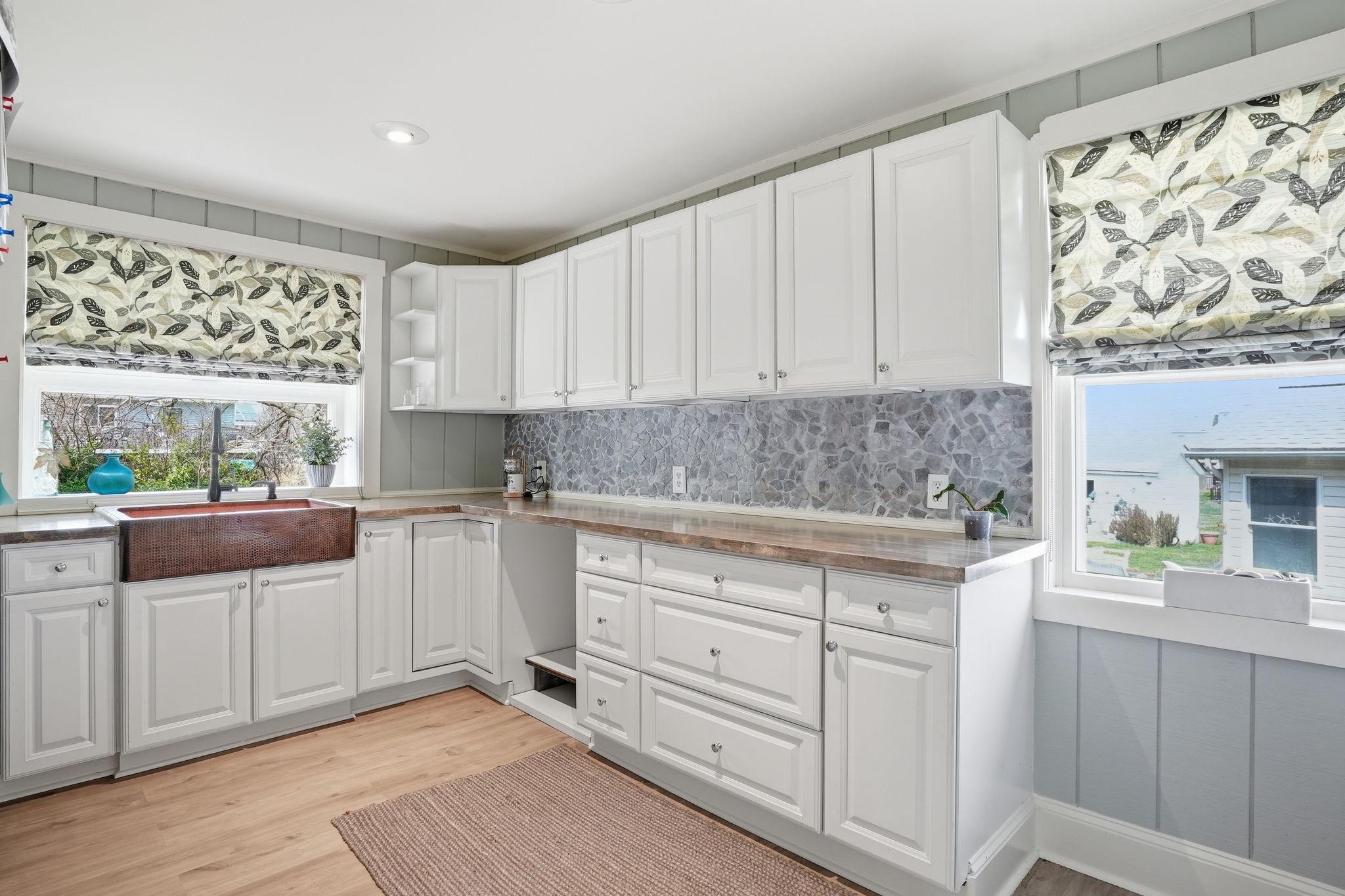7806 Summit Drive Pasadena, MD 21122 - Photo 21 of 74 a kitchen with granite countertop white cabinets and white appliances