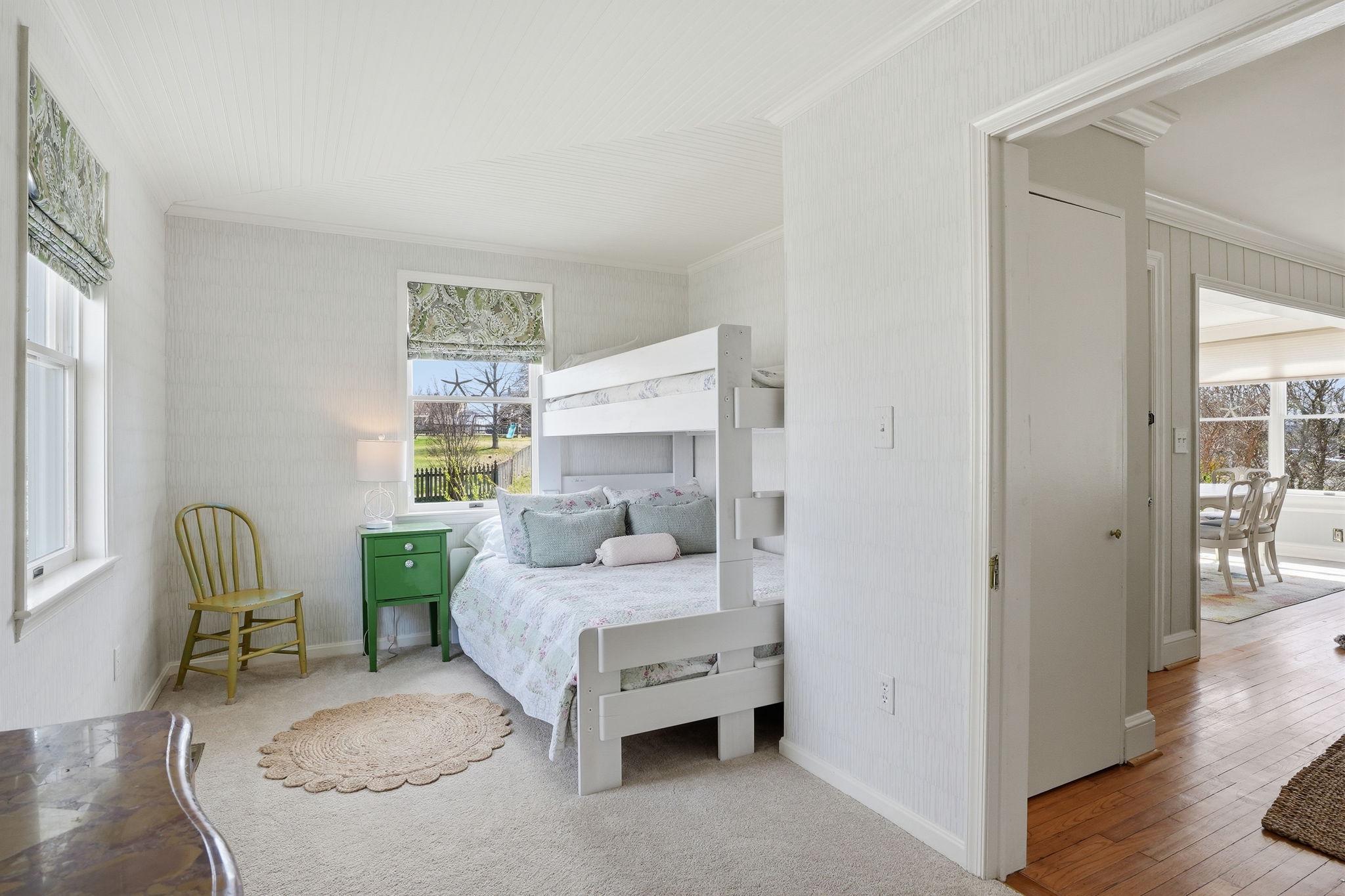 7806 Summit Drive Pasadena, MD 21122 - Photo 22 of 74 a bedroom with a bed and a chair