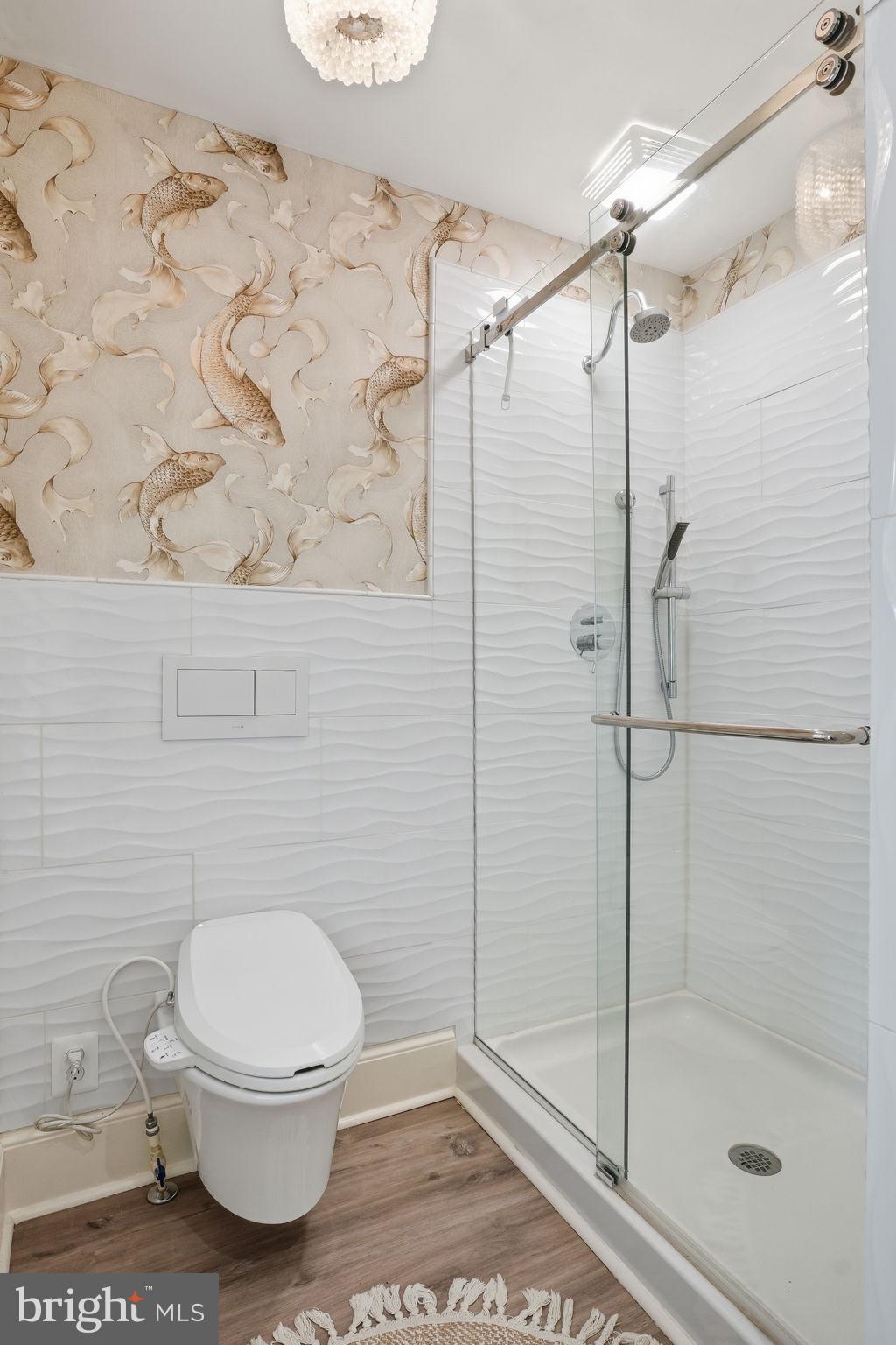 7806 Summit Drive Pasadena, MD 21122 - Photo 26 of 74 a bathroom with a toilet and a shower