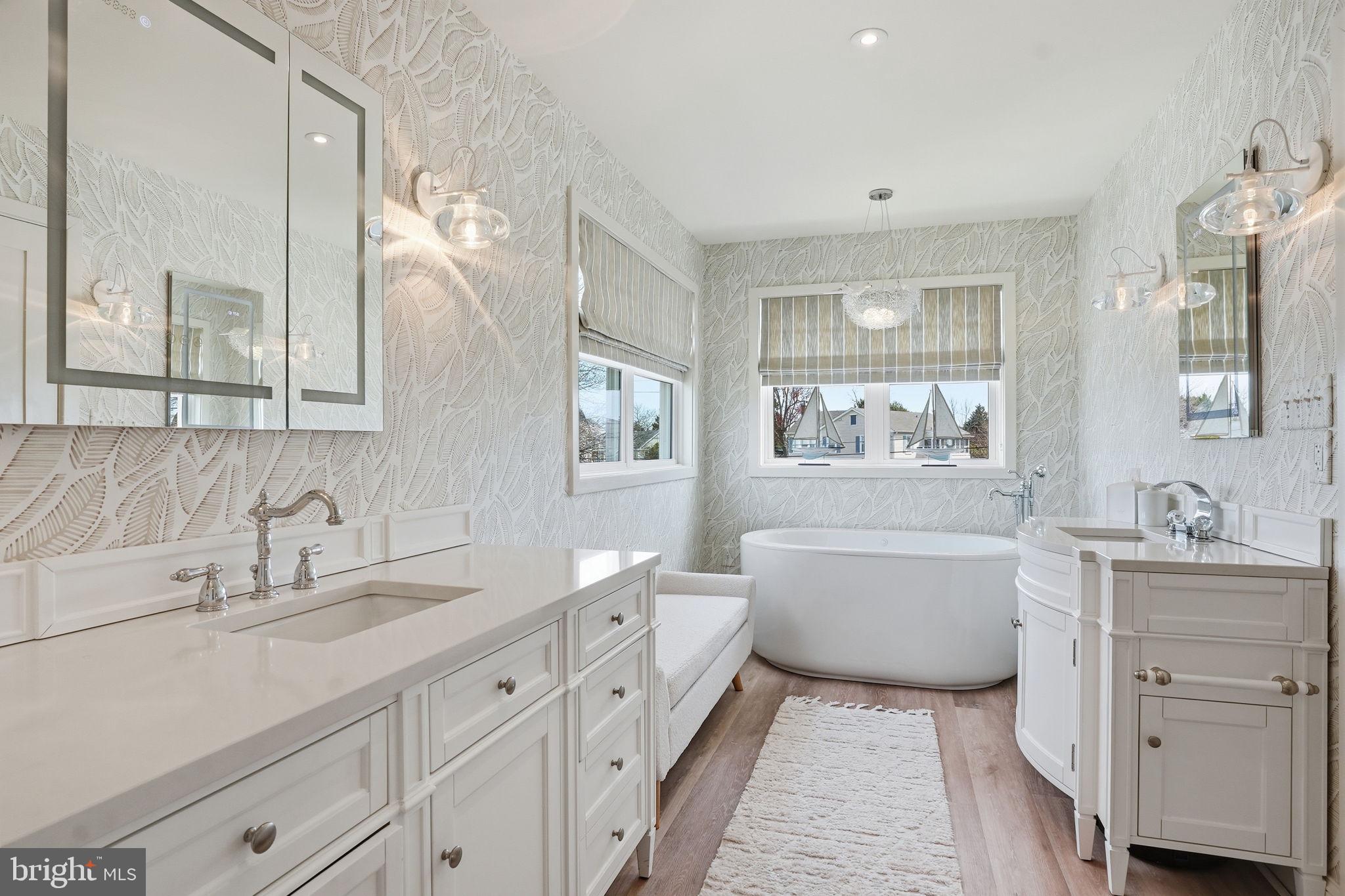 7806 Summit Drive Pasadena, MD 21122 - Photo 34 of 74 a bathroom with a tub sink and mirror