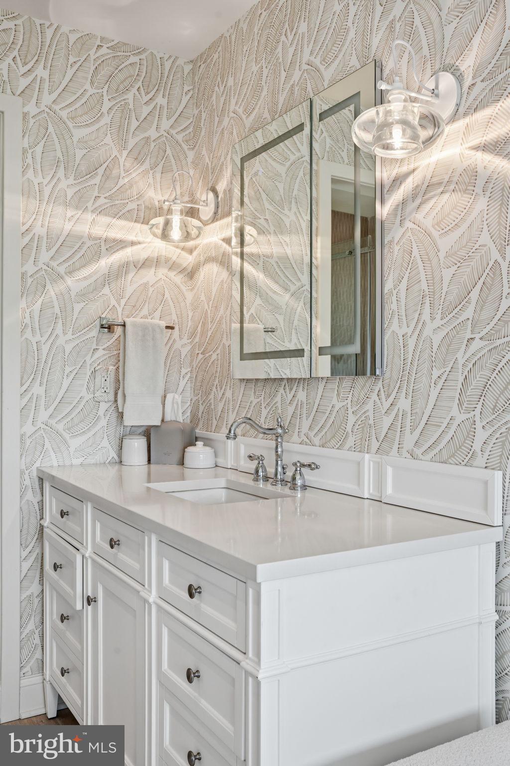 7806 Summit Drive Pasadena, MD 21122 - Photo 38 of 74 a bathroom with a sink vanity and a mirror