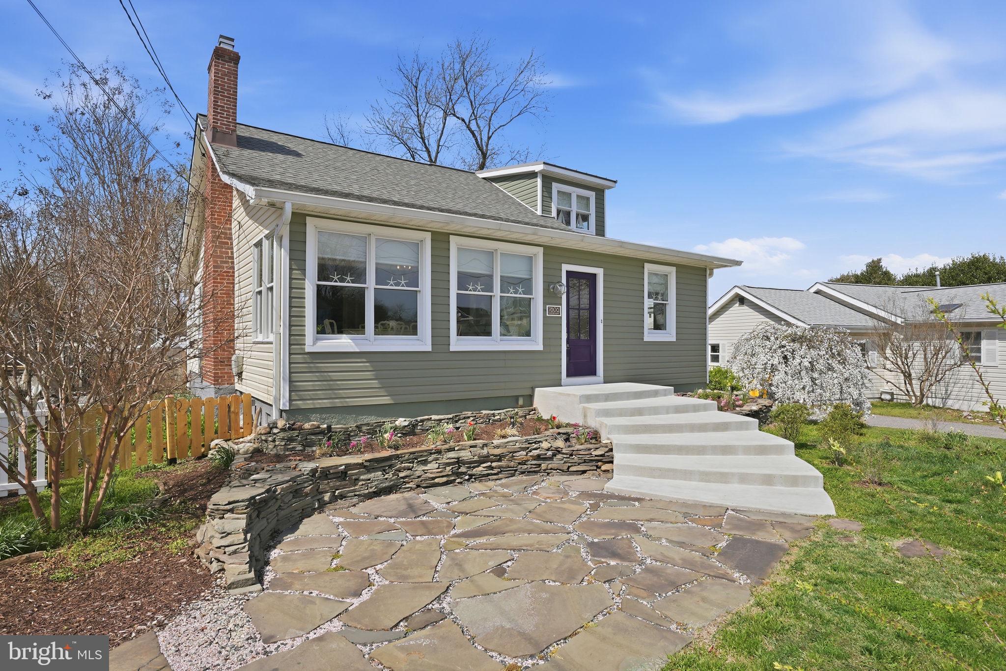 7806 Summit Drive Pasadena, MD 21122 - Photo 52 of 74 a front view of a house with a yard