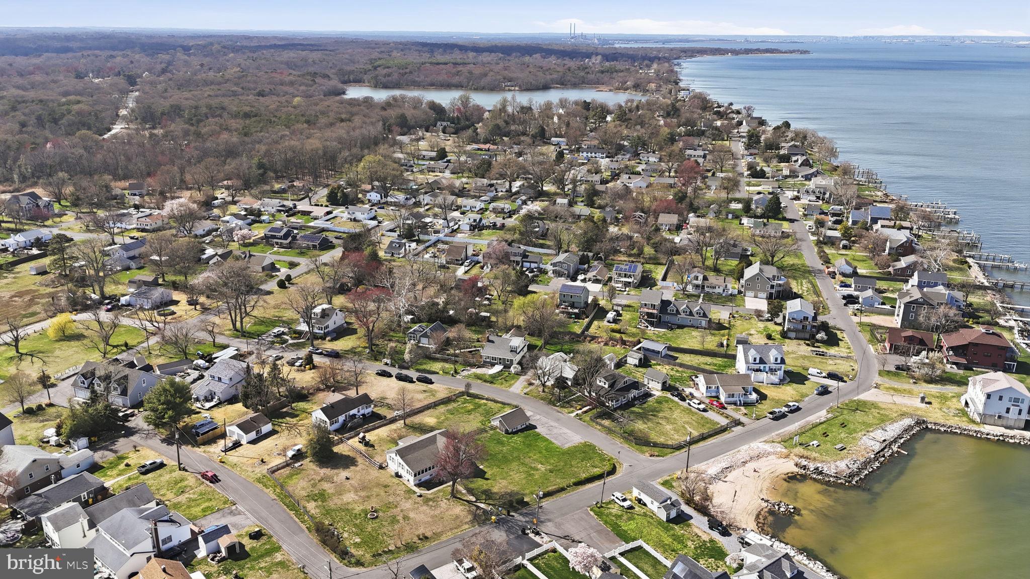 7806 Summit Drive Pasadena, MD 21122 - Photo 56 of 74 an aerial view of a house with a lake view