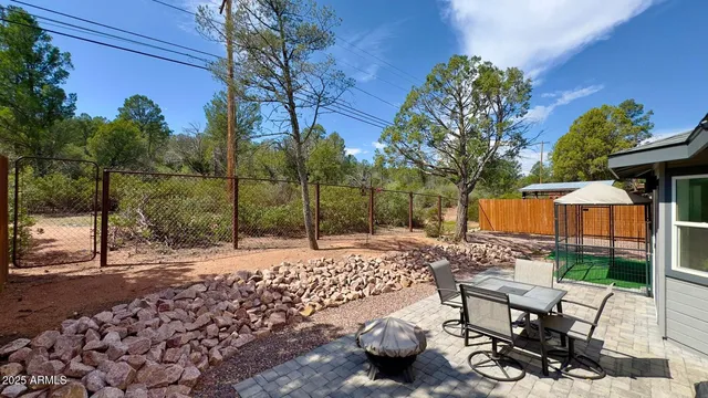 a view of a backyard with sitting area