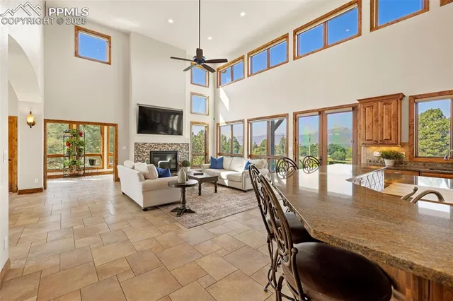a living room with fireplace furniture and a flat screen tv